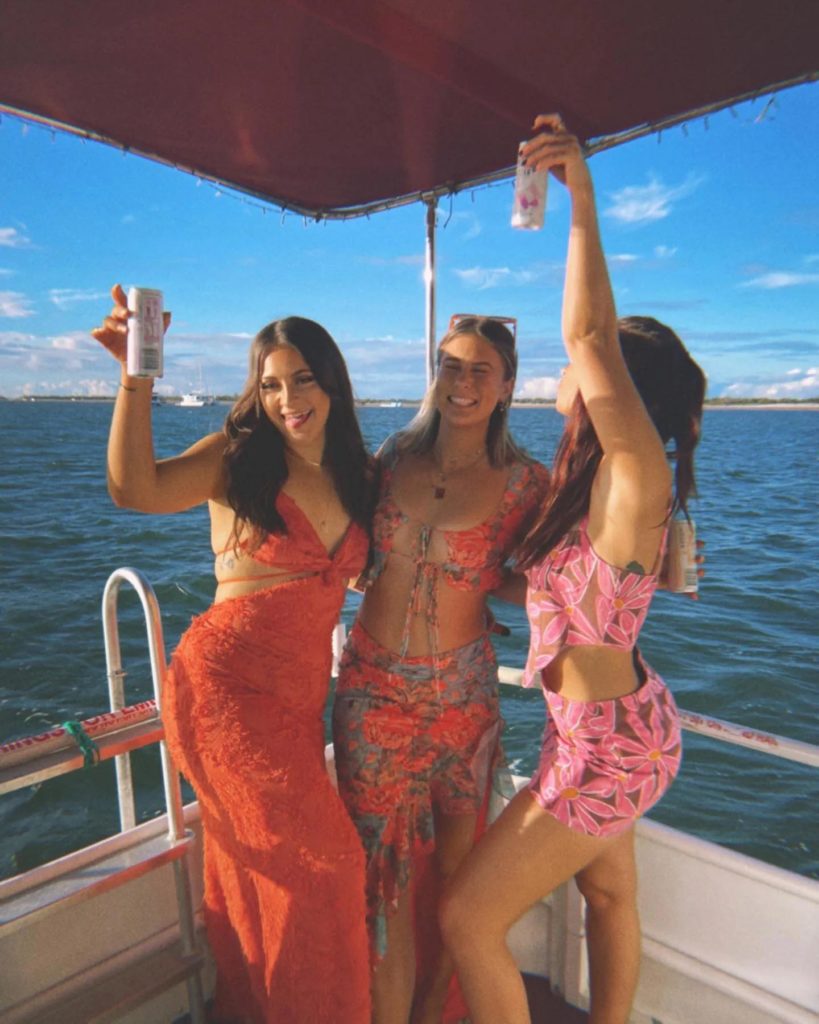 girls posing for party on boat