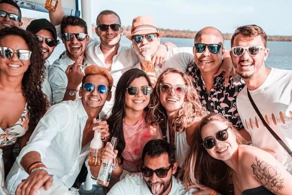 Group of friends enjoying drinks on a boat in gold coast
