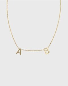 a small piece of jewellery with initials on it